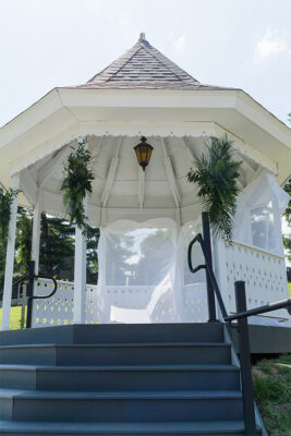 Wedding Gazebo White with greenery and white fabric